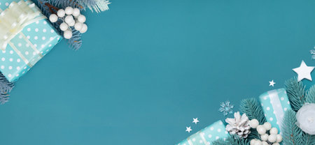 Merry Christmas insription greeting banner with flat lay Christmas gift, berries and pine turquoise...