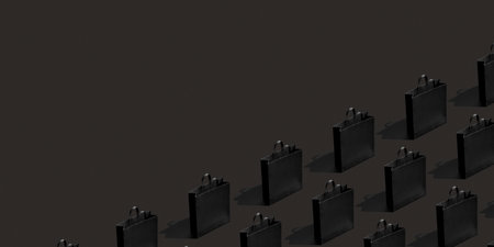 Pattern made from black paper shopping bags on black background. Black friday banner sale, shopping concept..の写真素材