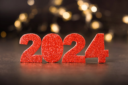 2024 glitter red numbers with bokeh background. Happy new year 2024 concept. High quality photo