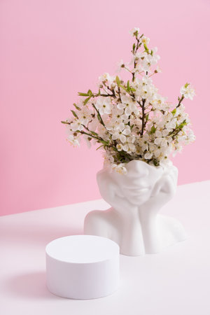 Empty podium or pedestal with spring bloom. Spring mock up for cosmetic products.の写真素材