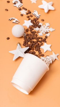 Mockup of coffee cardboard cups with Christmas decorations and coffee beans on colored backgroundの写真素材