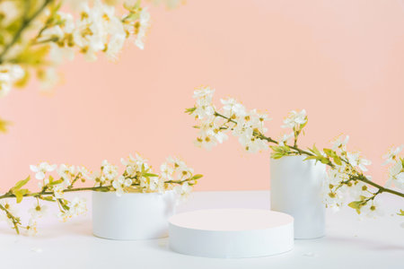 Empty podium or pedestal with spring bloom peach fuzz color background. Mock up for cosmetic products.の写真素材