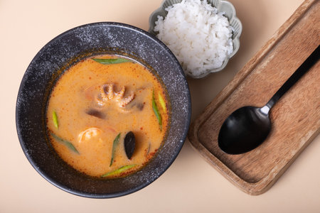 Tom yum soup and rice on a gray background angle view.の写真素材