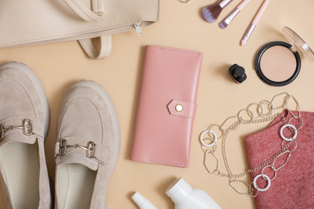Wallet, women's shoes, bag and cosmetics flat lay. Shopping, fashion blog concept. Top view.の写真素材