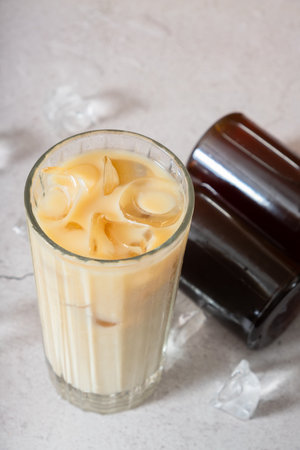 Cold brew coffee with milk and cold brew coffee in bottles with ice cube.の写真素材