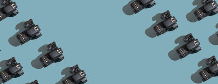 Banner with pattern from many cameras on a colored background with copy space. World Photography Day...