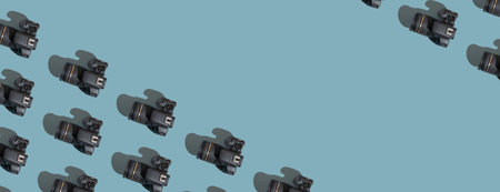 Banner with pattern from many cameras on a colored background with copy space. World Photography Day...