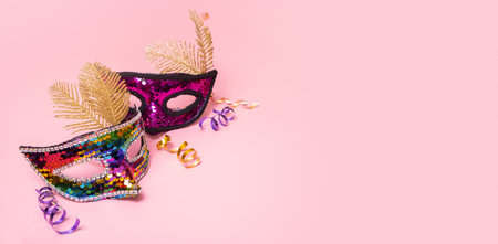 Festive face mask for carnival celebration on colored background with copy spaceの写真素材