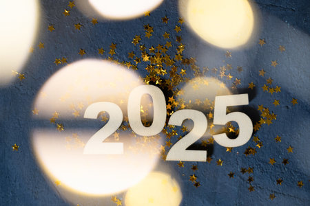 2025 new year numbers with golden stars and bokeh top view