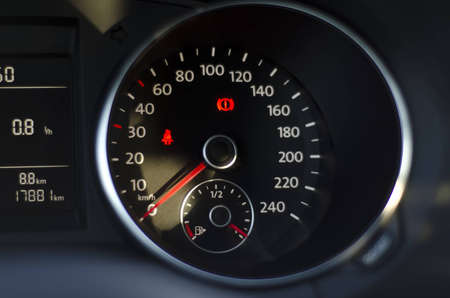 Dark, blurred image of car speedometer