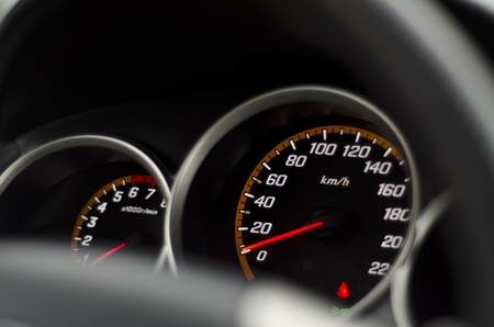 Image of black speedometer and tachometer