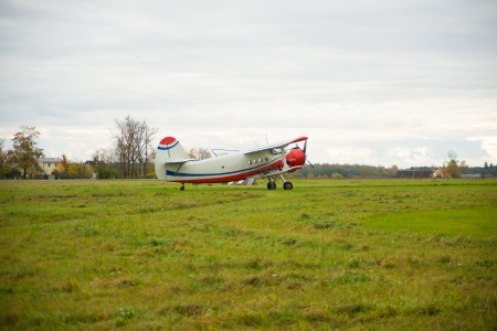 Image of vintage airplane in the fieldのeditorial素材