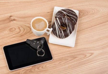 Image of coffee, donuts and tablet on wooden の写真素材