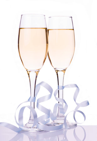 image of two champagne glasses over white backgroundの写真素材