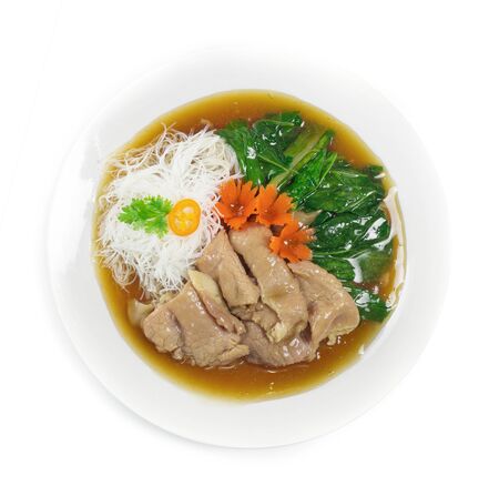 Thin Rice Noodles with pork ,kale  Chinese vegetables in gravy soy sauce soup Chinese style decorate with carved carrots popular food in street food of Thailand top viewの写真素材