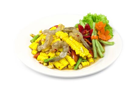 Corn salad with fresh shrimp in Thai spicy style healthy food Thai cuisine popular in Thailand decorate with carved vegetables side viewの写真素材