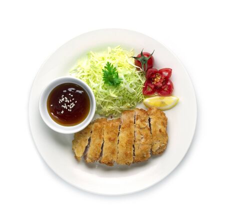 Tonkatsu or Fried Pork with tonkatsu sweet sauce Japanese food fusion style decorate vegetables carved tomato top viewの写真素材