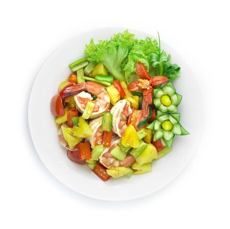 Stir Fried Shrimps with vegetable in Sweet and Sour Sauce Asian Food dish style decorate carved cucumber and chili peppers top viewの写真素材