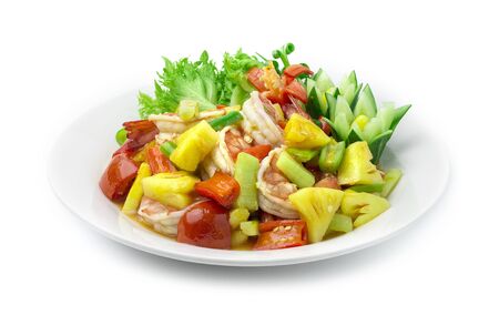 Stir Fried Shrimps with vegetable in Sweet and Sour Sauce Asian Food dish style decorate carved cucumber and chili peppes side viewの写真素材