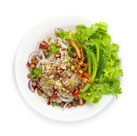 Spicy Salad Vermicelli Noodles with Minced Pork, vegetable,Peanut Sprinkle Hot Spicy Tasty Thai Food fusion style decorate carved cucumber, chili peppers and spring onion top viewの写真素材