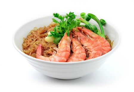 Casseroled shrimps with glass noodles or Shrimp Potted with Vermicelli Noodles in Bowl Asian Food Thai fusion style decorate carved springs Onion and Garlic, Cutlet Coriander Thai herbs side viewの写真素材