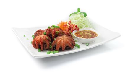 Octopus fried in soy sauce Served Seafood Spicy Sauce Appetizer Dish Street Food Asian Style side viewの写真素材