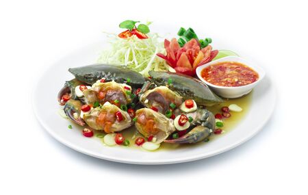 Pickled Crab in Sweet fish sauce Served Spicy Chili Sauce Thai Food Hot Tasty decorate vegetables and carved chili side viewの写真素材