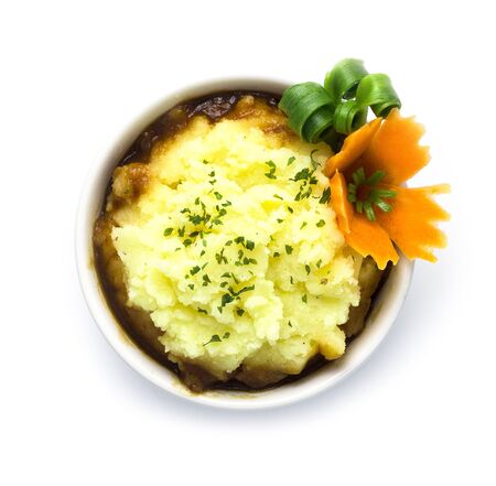 Mashed potato creamy classic holiday traditions food perfect time with gravy sauce decorate carved carrot and spring onion side view isolated on white backgroundの写真素材