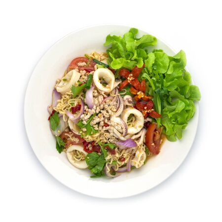 Spicy Salad Instant Noodles with Squids and Minced Pork, vegetable, Hot Spicy Tasty Thai Food fusion style decorate carved cucumber, chili peppers and spring onion top viewの写真素材