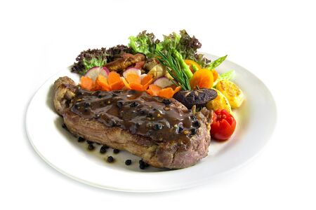 Beef steak with black peppers sauce decorate fresh rosemary, broccoli grilled oyster mushroom and radish salad  carved vegetables style side viewの写真素材
