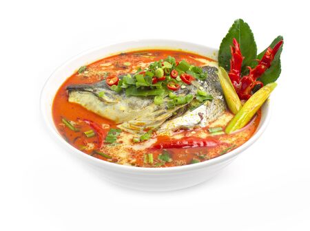 Thai Spicy Salmon Soup Hot chili in coconut milk Thai spicy food (Tom Yum Salmon) the best of Thailand decorate carved chili side viewの写真素材