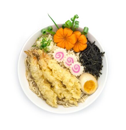 Miso Ramen thin Noodles in soy soup Japanese food style served  tempura, boiled egg ,slice seaweed decorate with carved vegetables style goodtasty top viewの写真素材