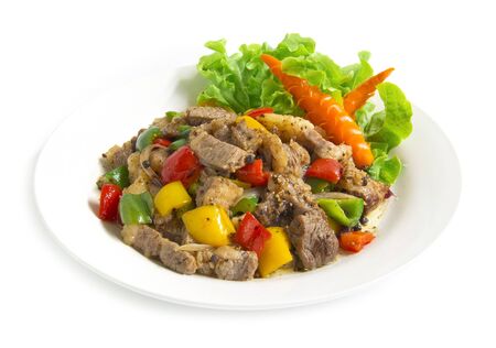 Stir Fried Beef with Black pepper and bell peppers,oyster sauce spicy food decorate with carved vegetables,chili style side view isolated on white backgroundの写真素材