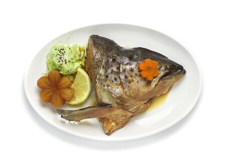 Salmon Kabutoni in soy sauce soup Japanese food fusion style decorate vegetables carved and carrot...