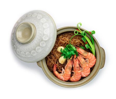Casseroled shrimps with glass noodles or Shrimp Potted with Vermicelli Noodles in Ceramic Pot Asian Food Thai fusion style decorate carved springs Onion and Garlic, Cutlet Coriander Thai herbs top viewの写真素材