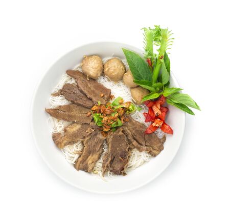 Vermicelli Noodles with Braised Stewed Beef without soup (kuay tiew nuae toon) Thai food dish decorate with vegetables style top viewの写真素材