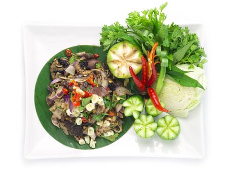 Spicy Raw Offal Beef Salad with ingredient Spicy Herbs Thai Food Popular in Northern Style decorate with carved cucumber and vegetables top viewの写真素材