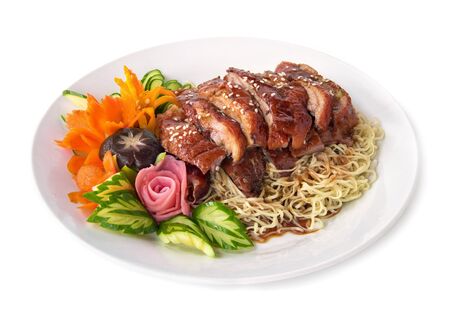 Roasted duck on Egg Noodles with sweet sauce fusion food Chinese style decorate with carved vegetables the best top ten popular of Chinese and Thailand side viewの写真素材