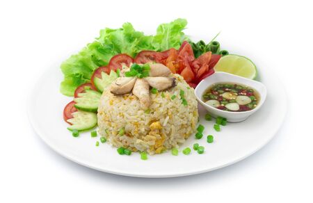 Fried Rice with Crab and  Eggs Thai Food and Asian Food fusion style decorate  vegetables carved tomato Spring onions side viewの写真素材