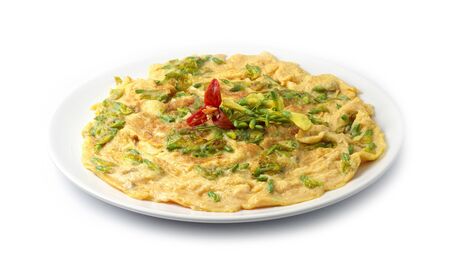 Omelette  Fried Eggs with Sesbania Flower Pancake Thai food fusion style decorate carved chili peppers side viewの写真素材