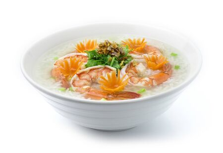 Rice Porridge boiled with Shrimps cooking tasty Maincorse Thai food fusion style decorate mix Chinese food style decorate with carved carrots and vegetable cutlet,Crispy Garlic side viewの写真素材