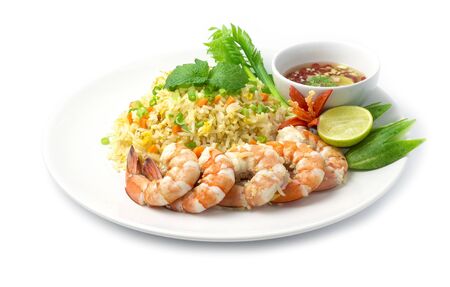 Fried rice with shrimp decorate with vegetables carved food dish famous Chinese and Thai food fusion style popular menu in Thailand side view isolated on white backgroundの写真素材