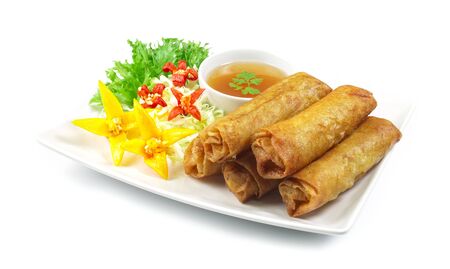 Vegetables Spring Roll deep fried Thai food fusion with Chinese style decorate with vegetables and sweet chili sauce side viewの写真素材