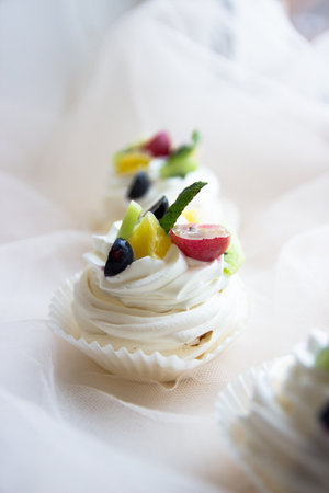 This stock photo shows an Italian meringue set decorated with fruits.の写真素材