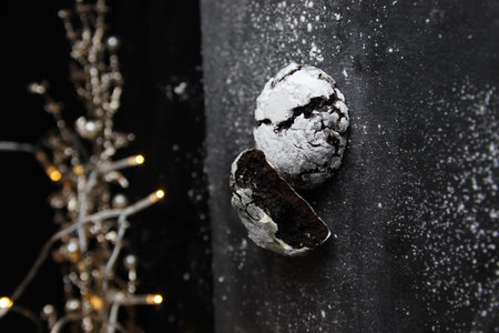 This stock photo shows Christmas-themed marble chocolate cookies on a black background.の写真素材