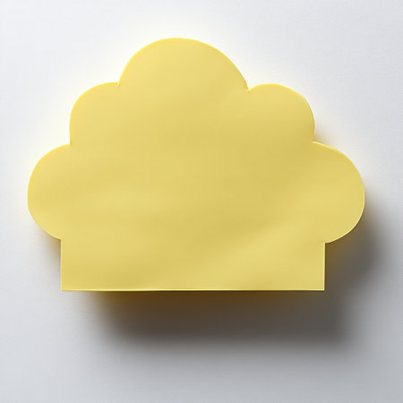 A playful yellow sticky note shaped like a cloud sits on a clean surface.の素材