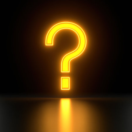 A bright yellow question mark shines in darkness, inviting thoughts and inquiries.の素材