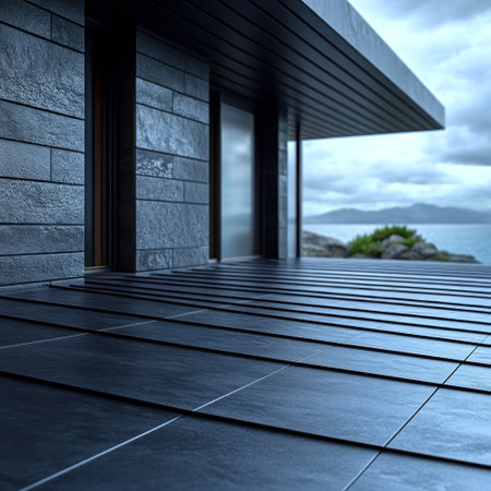 A sleek stone terrace provides a stunning view of the ocean under a cloudy sky.の素材