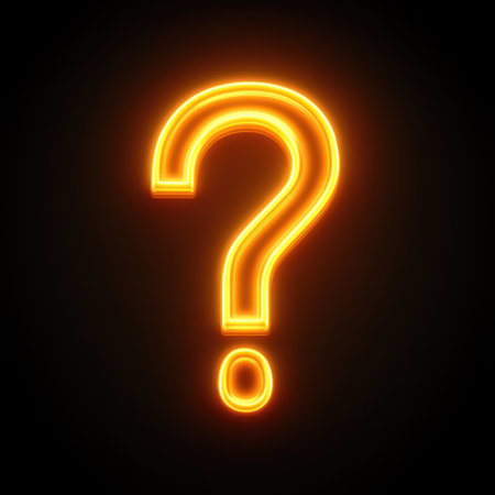 A glowing orange question mark lights up the darkness, provoking thoughts and wonder.の素材