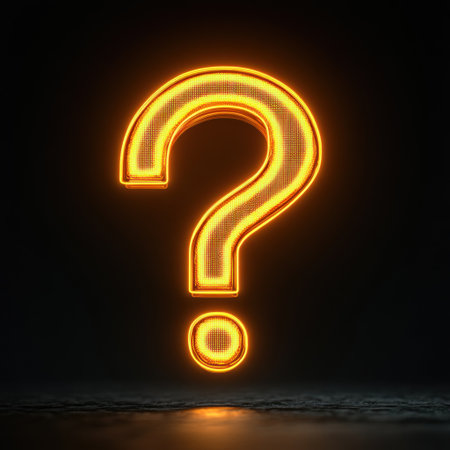 A glowing orange question mark lights up a dark space, inviting curiosity and wonder.の素材